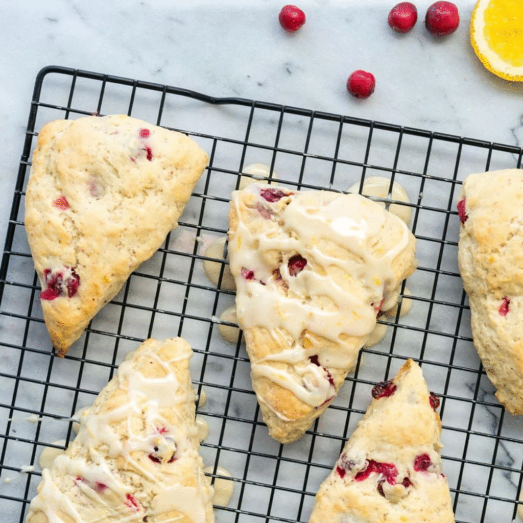 Buttery, flaky Cranberry Scones bursting with juicy fruit and citrus zest a perfect tea-time indulgence, baked fresh with premium ingredients.