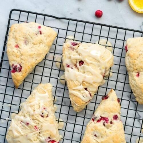 Buttery, flaky Cranberry Scones bursting with juicy fruit and citrus zest a perfect tea-time indulgence, baked fresh with premium ingredients.